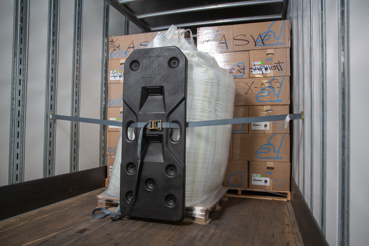 Freight Brace installed with straps against a palletized super sack